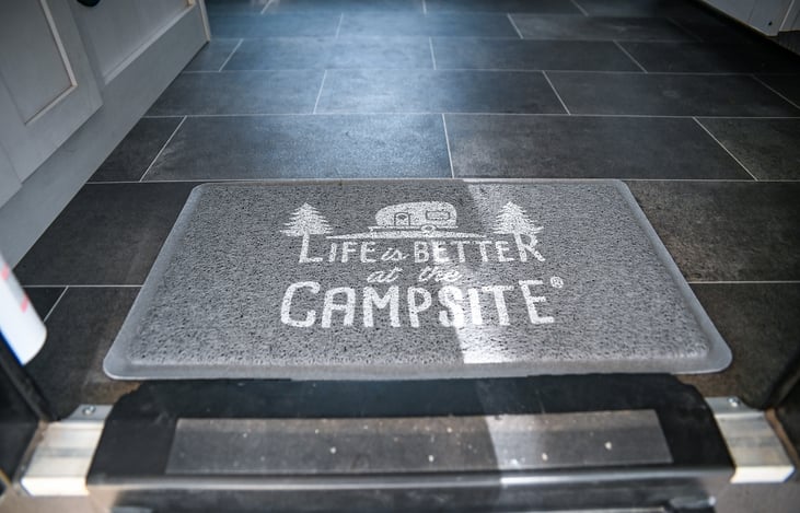 Welcome to your home away from home! Our 'Life is Better at the Campsite' rug adds a cozy touch right at the entry, setting the tone for a relaxing and enjoyable stay.