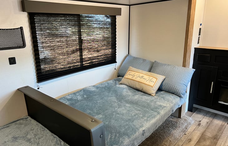 This comfy bed  is perfect for kids or one adult. 
Crack the window and let the nature ambience in.
