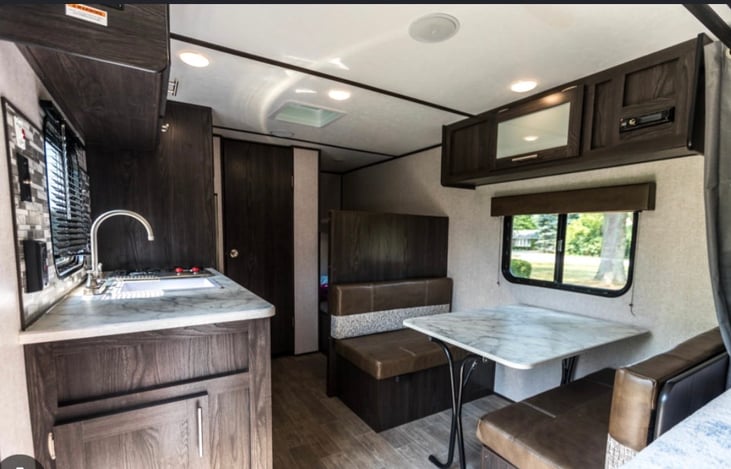 Dinning, kitchen (stove, microwave, fridge) and bathroom (shower and toliet)