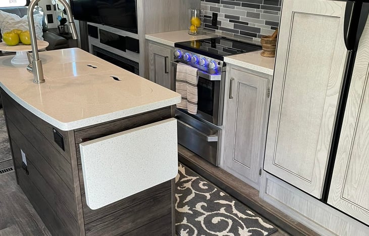 Ambient lighting on the range, under lighting on the island and above the pendants.