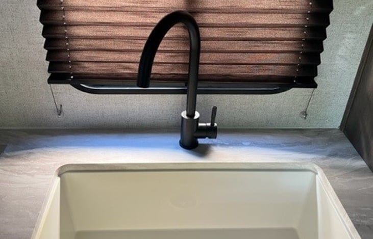 Large sink with removeable cover for additional countertop space.