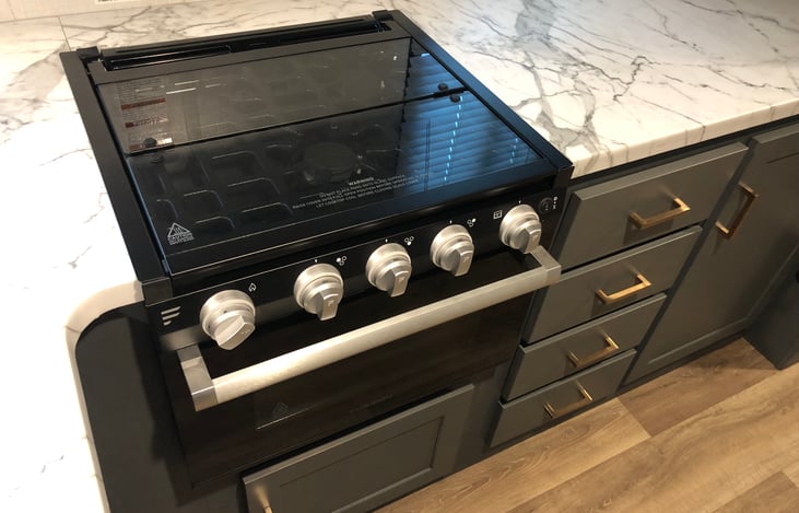 Three burner stove and oven.