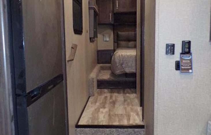 Restroom and master bedroom located towards the front of the RV.