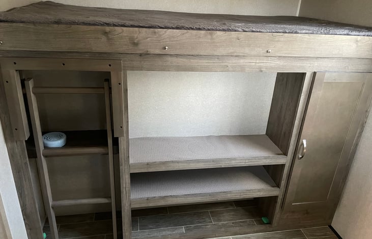 4 USB ports in the Bunkhouse.  Ladder up to the widest bunk.