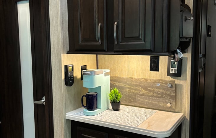 Keurig provided, with all the basic necessities, including K-cups, assortment of hot teas, and mugs.