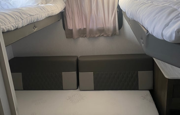 Private bunkhouse.  Two twin beds, 1 full size bed, TV and storage.