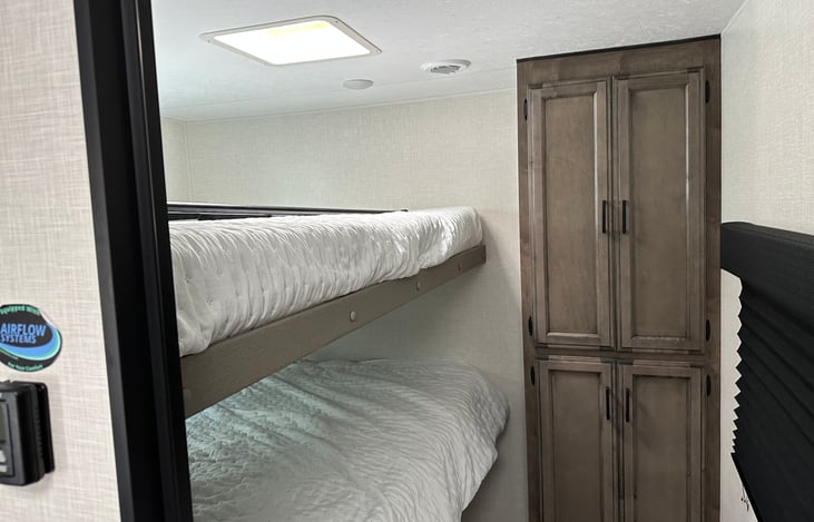 Queen size bunk room with door for privacy