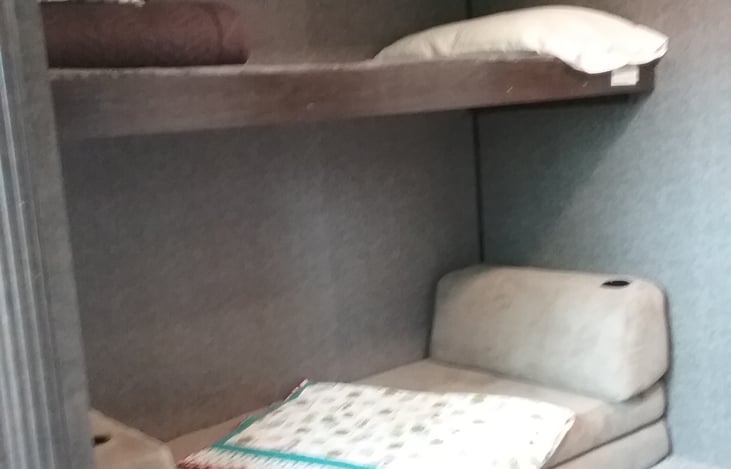 Upper bunk and cube couch that makes into 2 twin beds or a queen bed when unfolded.