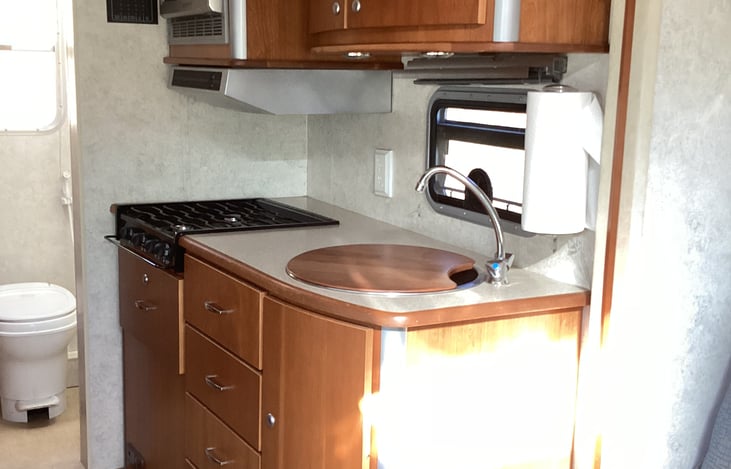 4 burner stove, sink, and microwave