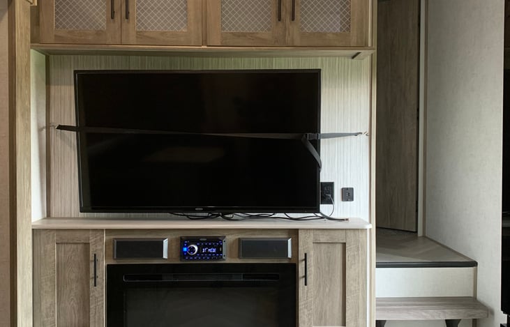 TV and Electric Fireplace.