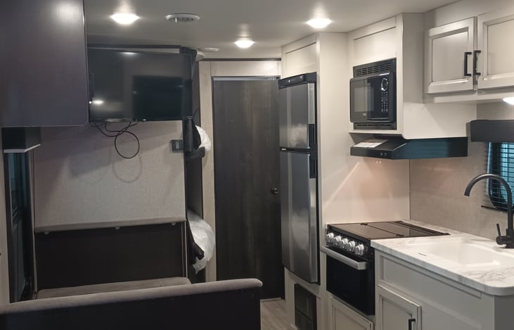 All major appliances. TV, Radio, refrigerator, microwave and gas top stove /oven