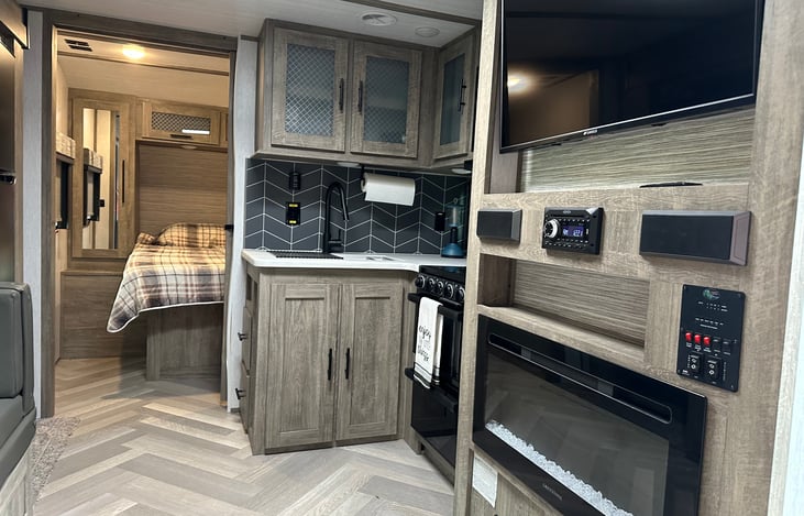 COZY FIREPLACE HEATS THE RV DURING THOSE COOLER NIGHTS