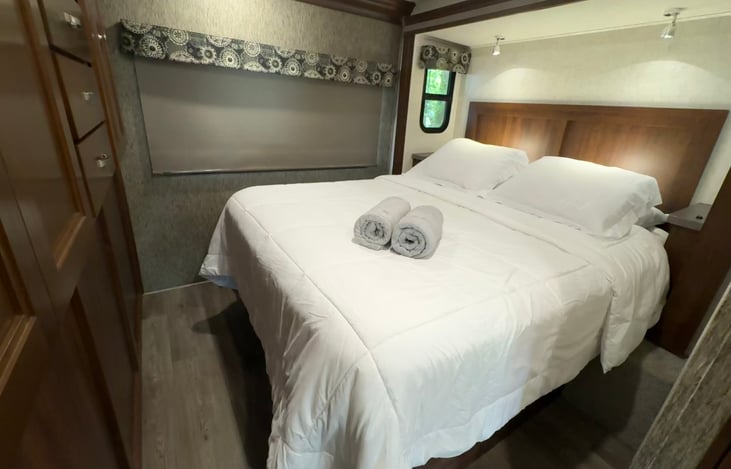 Bedroom features a queen bed (RV queen Serta mattress 60" wide by 74" long)