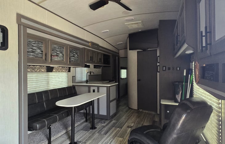 Main Area. Has 2 Recliners. A Couch with a table. The table can be removed and the couch can turn into a small bed for a child or small child. Also has a TV with DVD player.