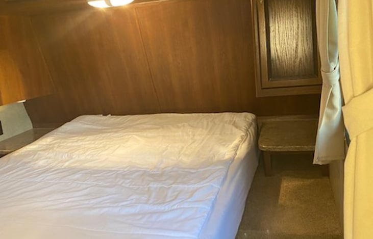 Master bedroom with a queen size bed.