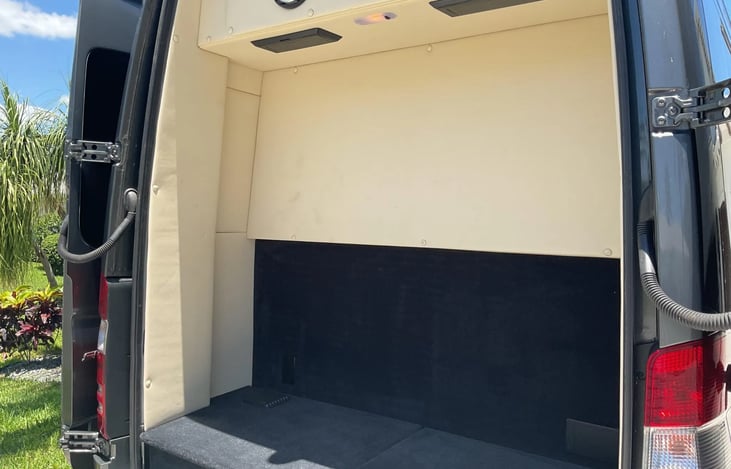 Ample Rear Luggage Storage with Hangers