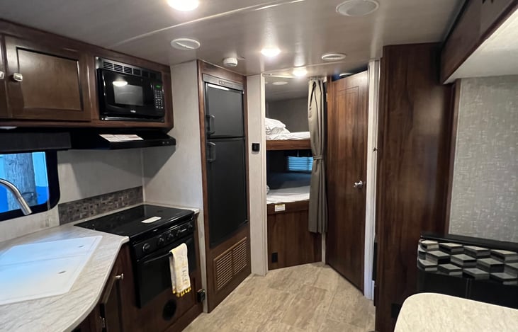 Bunk bed and kitchen area