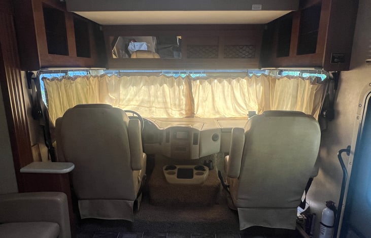 Captain's chairs with bunk up.