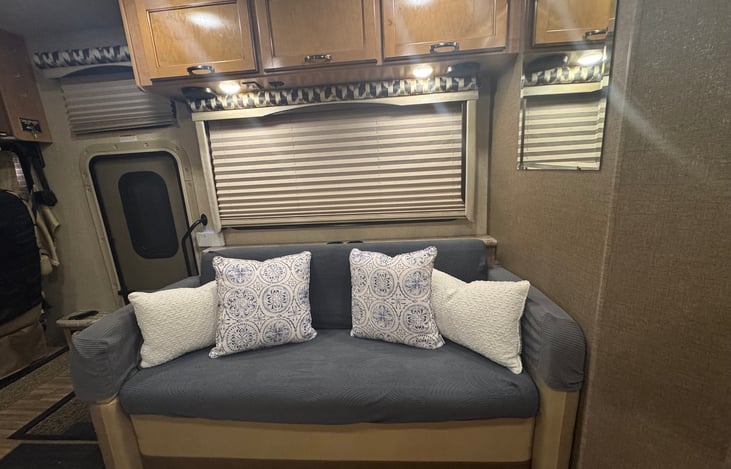 Couch pulls out and pops down for sleeping, very similar to a futon.