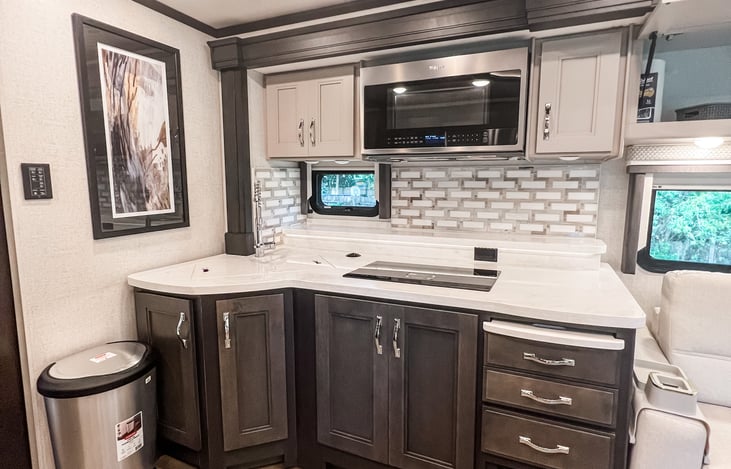 Fully-equipped kitchen with modern appliances and ample counter space"