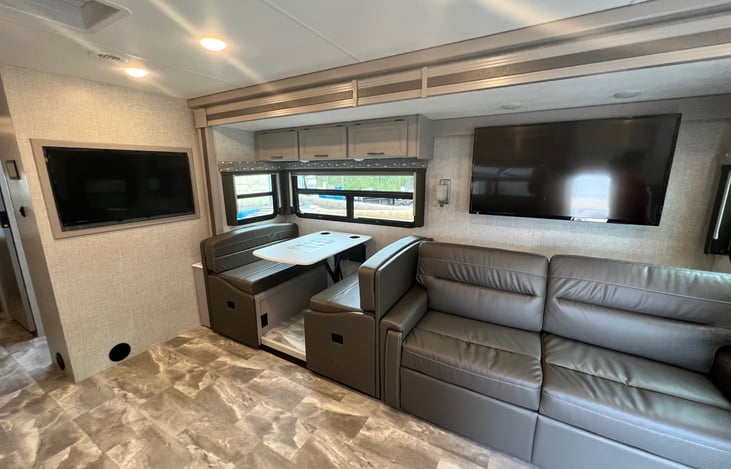 Dinette and 2 person couch which both can sleep people. Couch up to 2 persons and dinette one small person.