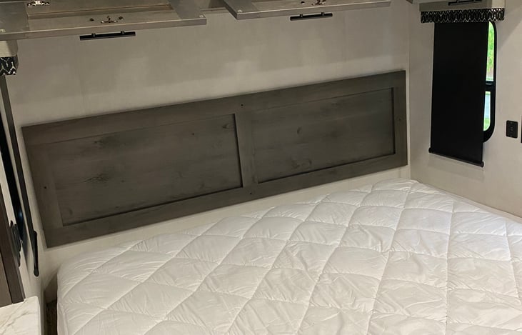 Extra cabinets above the king size bed.