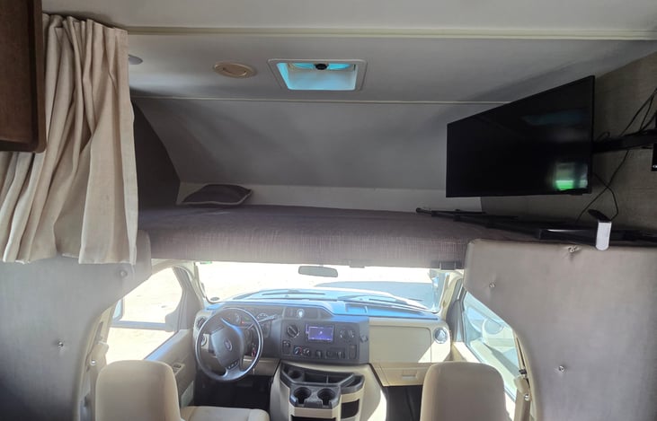 Overhead Bunk: Sleeping area above the cab, rated for two average-sized adults.