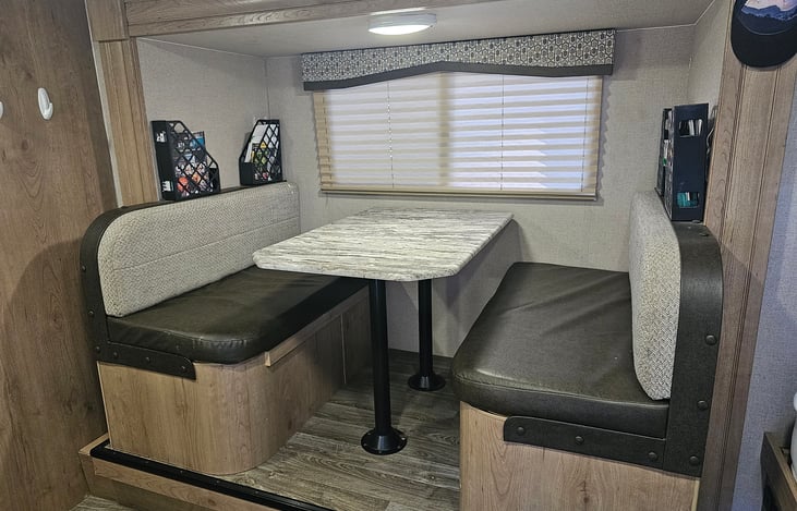 Dinette with under-seat storage can also convert to an additional bed
