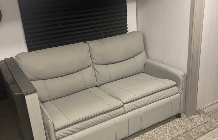 Converts into a bed, can hold three kids or two adults