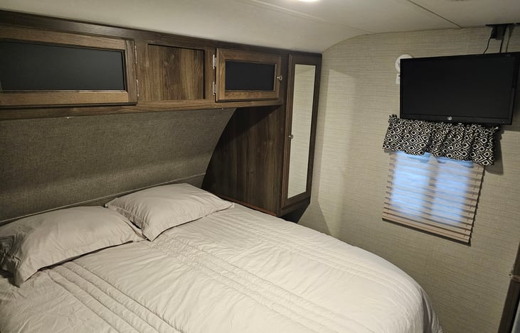 Master bedroom with queen bed and TV with Roku.