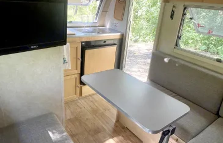 Rotatable and removable dining table. We prefer meals outdoors! But it's SO NICE to have this as an option during rain, wind, or winter camping.