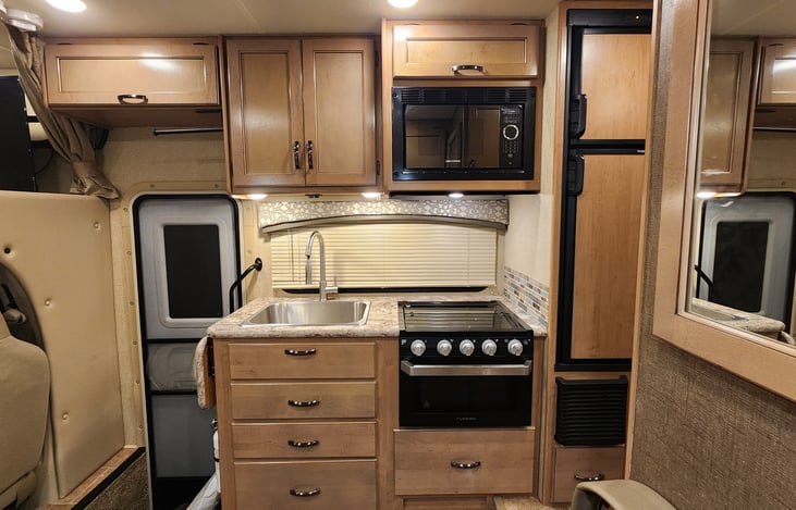 Kitchen area with fridge and freezer.
