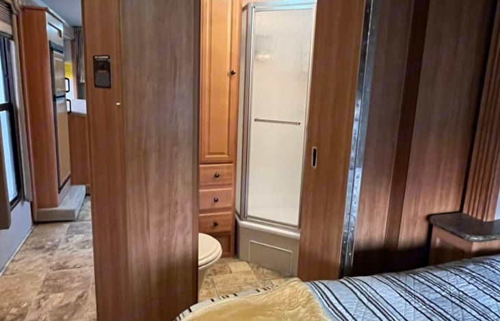 A LOOK FROM THE BEDROOM INTO THE BATHROOM