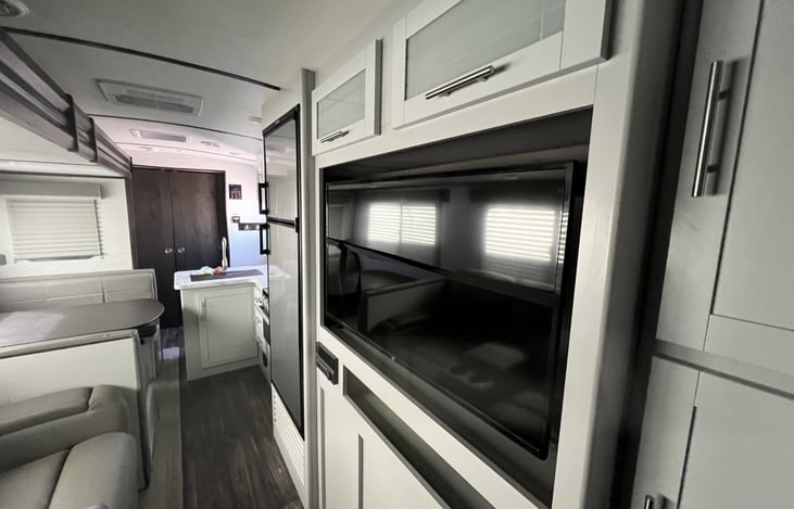 40" TV with DVD capability and over air digital channels. Can hook up to cable if in a campground with cable hook-ups.