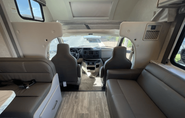 Large two person bunk over driver seat with skylight