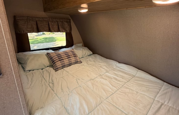 Snuggle up and relax in this cozy full-size sleeping space after a day of adventure.