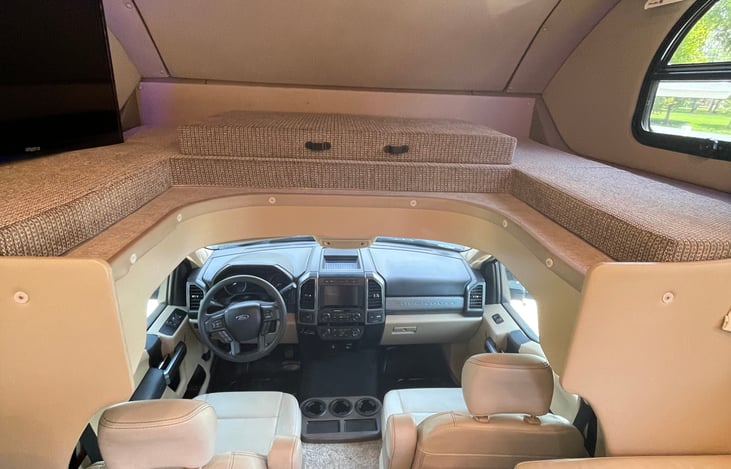 Over the cab bed. Easily sleeps two and has a privacy curtain.