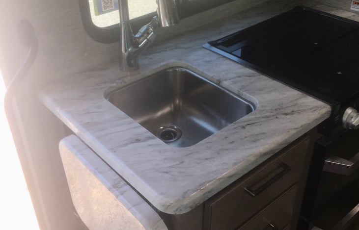 Our stove, sink and prep station along with the pull up counter extension offers ample room for meal prep and cooking