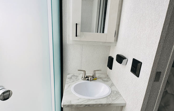 Great medicine cabinet and sink. Off grid water pump allows hot showers at any time of the day!