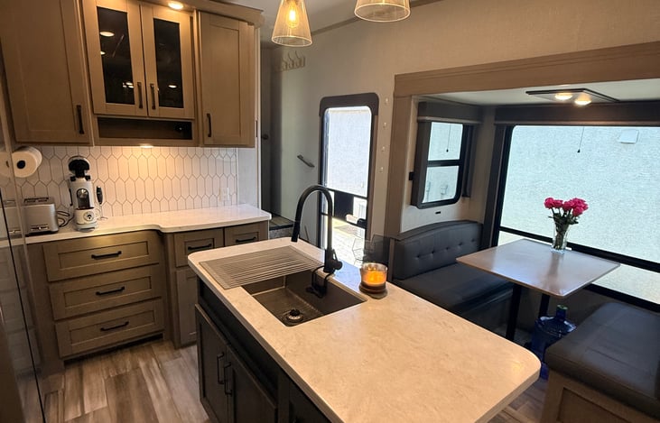 Main cabin kitchen/dinette with Keurig coffee maker, toaster and all kitchen supplies you could want.