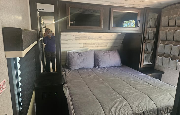 Master sleeping area has a barn door for privacy.