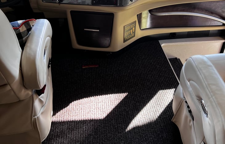 The 36GH Tiffin often features a custom entry mat at its entrance, providing a clean surface for guests to wipe their feet. These mats enhance the entryway's aesthetic and help keep the interior clean