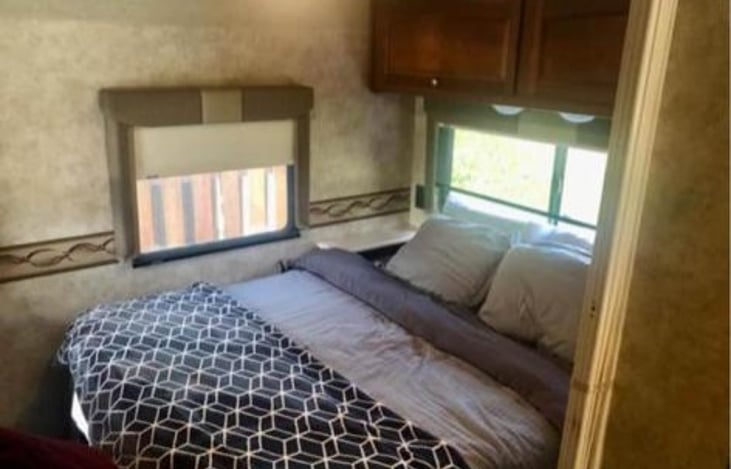 Queen Bed and tons of storage in the rear.