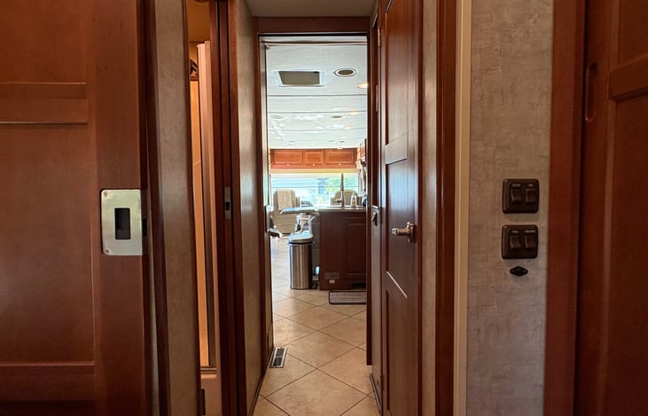 looking back to the bedroom with toilet on left and shower on right