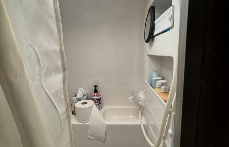 On demand hot water heater. Great shower pressure.