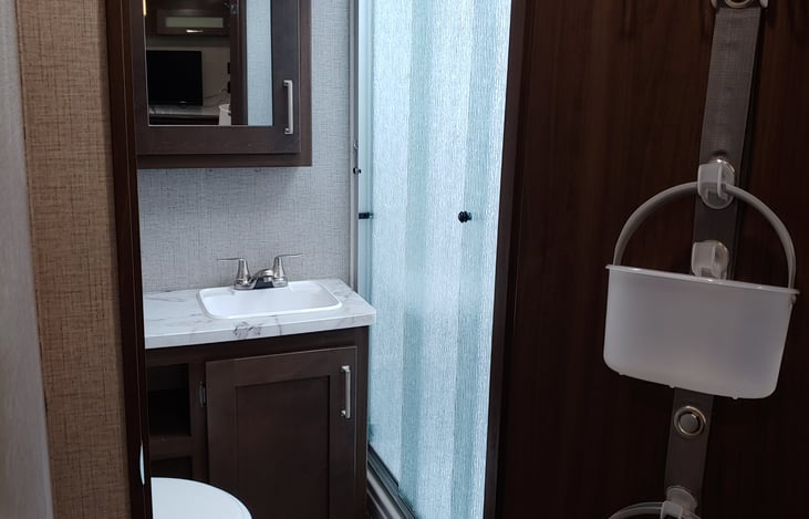 Bathroom with full width shower and sliding doors