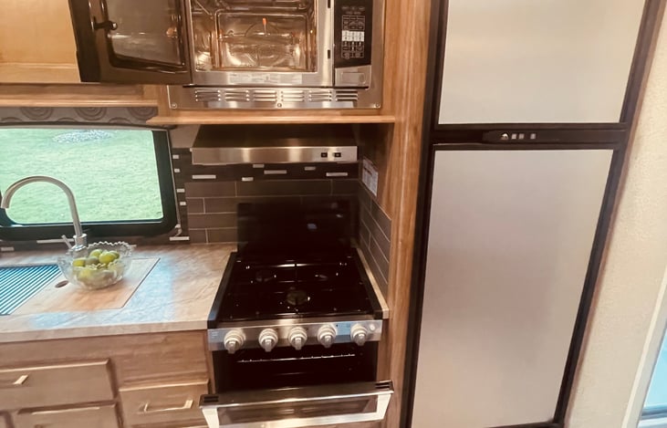 3 burner stove, full size microwave and convection oven.