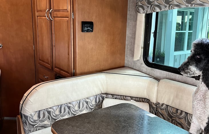 table and seating area that converts into a full bed. Hypoallergenic poodle not included.