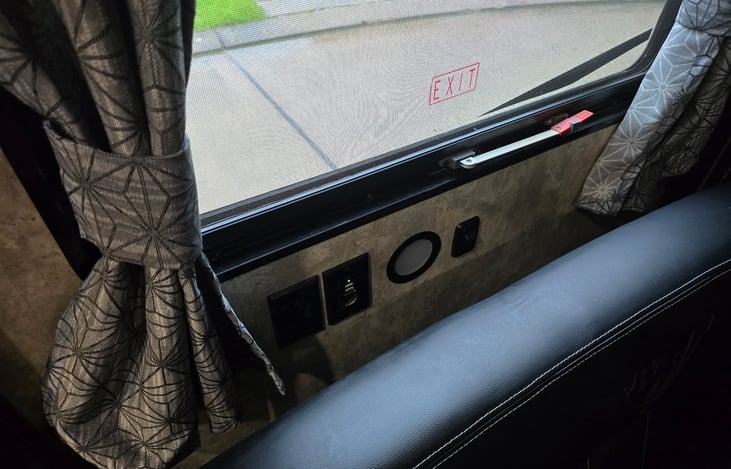 More electrical outlets, usb outlet, and light under rear passenger window, that is also an emergency exit.