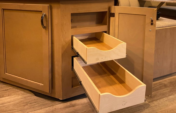 Drawer space for spices and small containers right below the sink and range